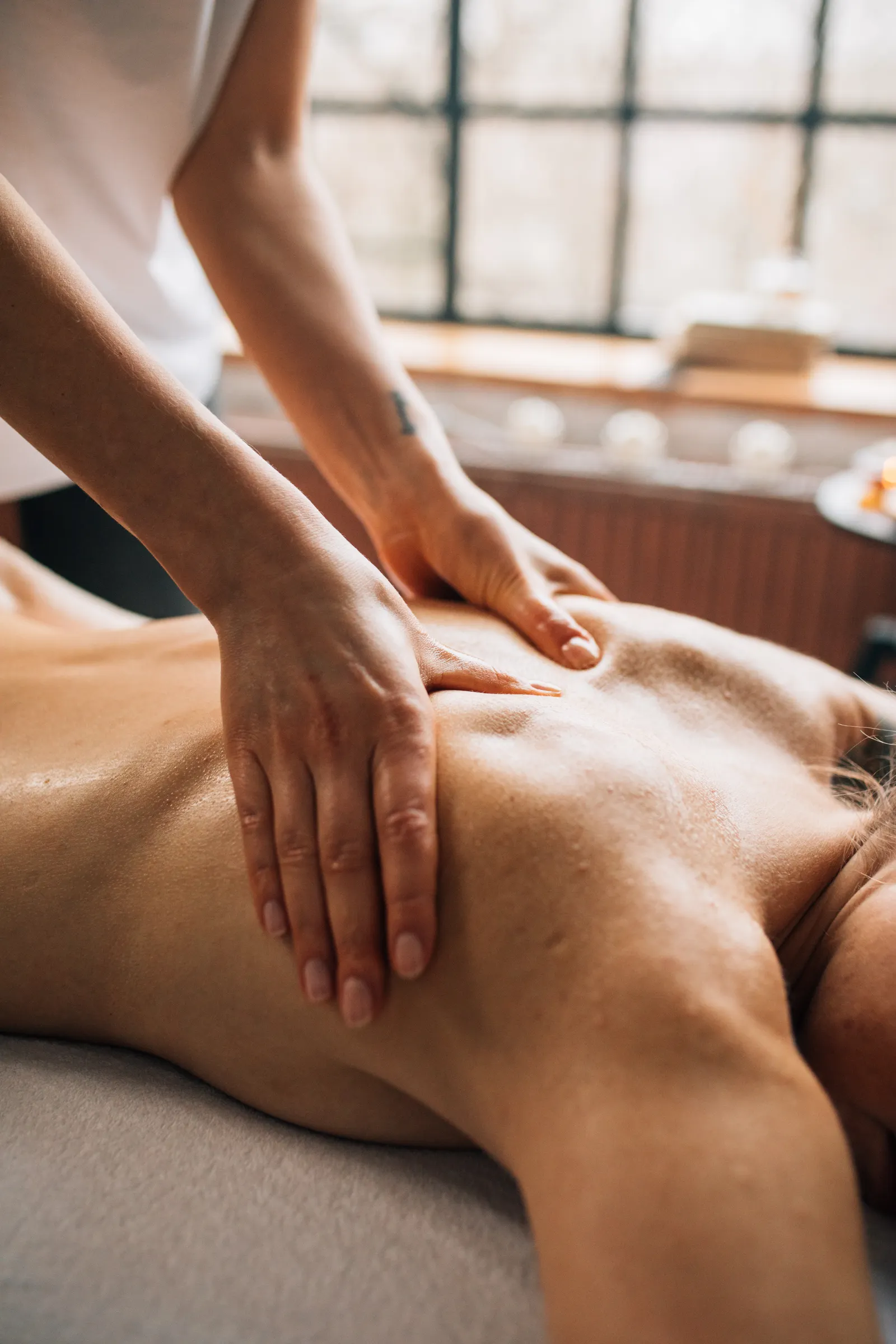 A calming body massage session in a serene spa room